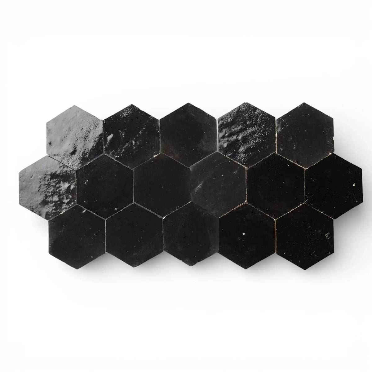 Handmade black hexagon zellige tile with glazed surface and natural variation