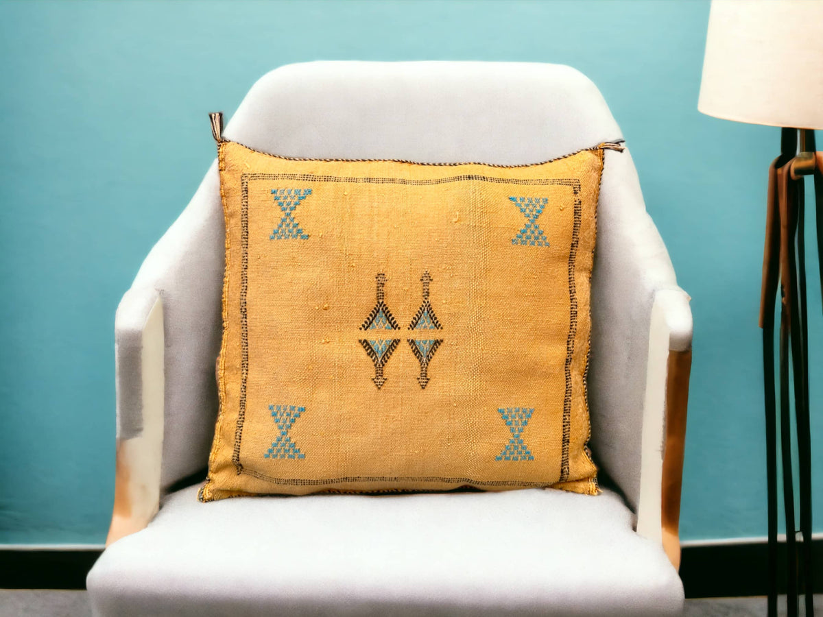 Handmade lumbar cushion with intricate Moroccan Sabra design, perfect for home decor.