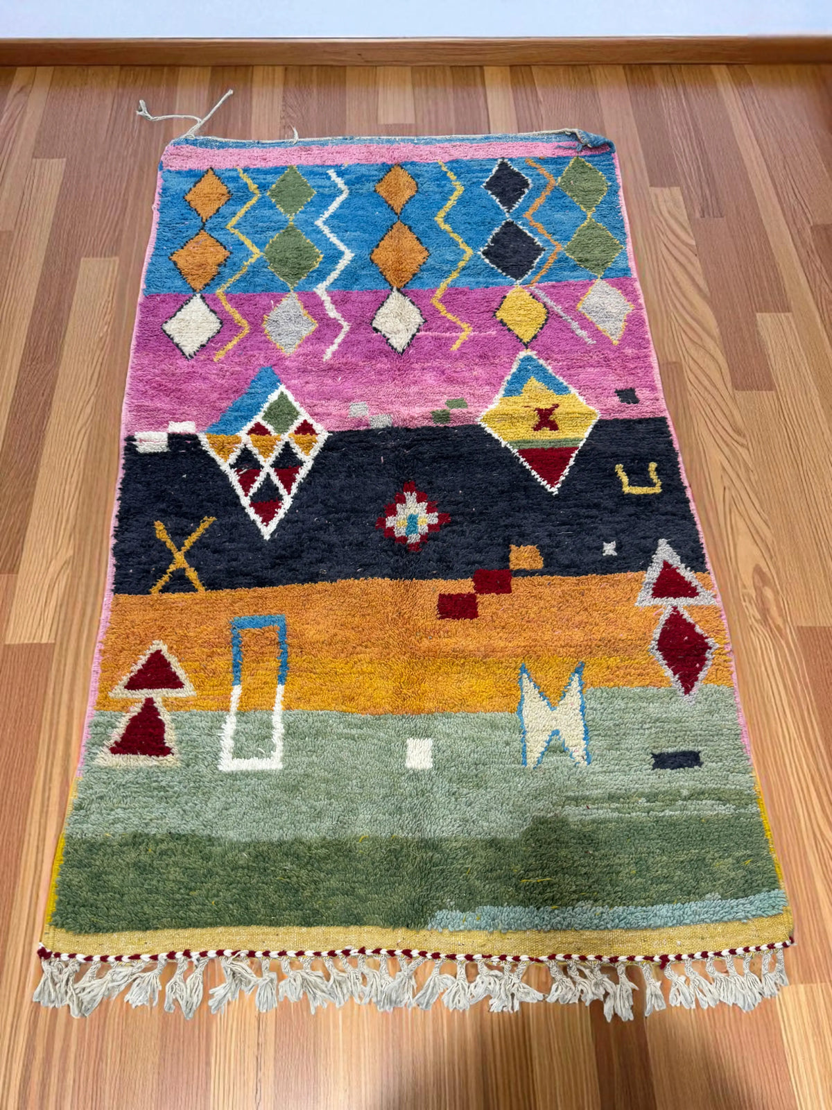 Handwoven Moroccan Bjaad carpet with tribal geometric motifs in multicolor wool, 264 × 151 cm