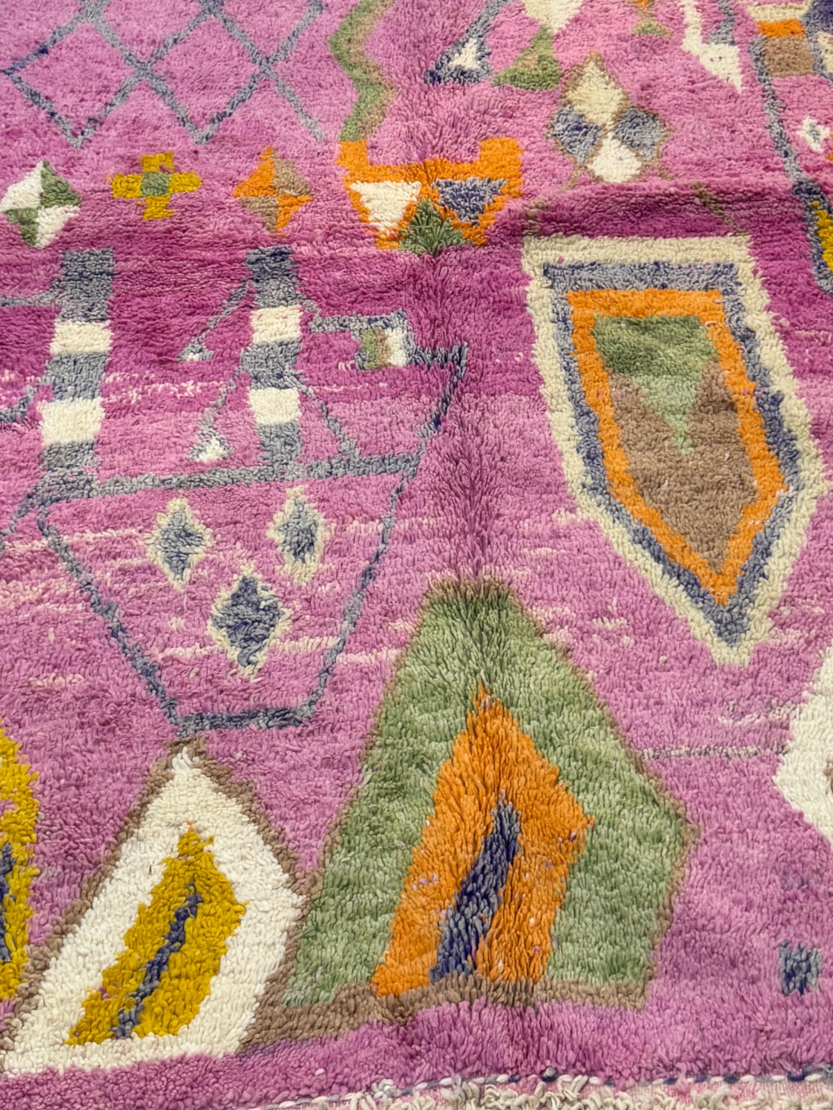 Handwoven Moroccan Bjaad carpet with blush pink geometric tribal motifs in multicolor wool, 269 × 147 cm
