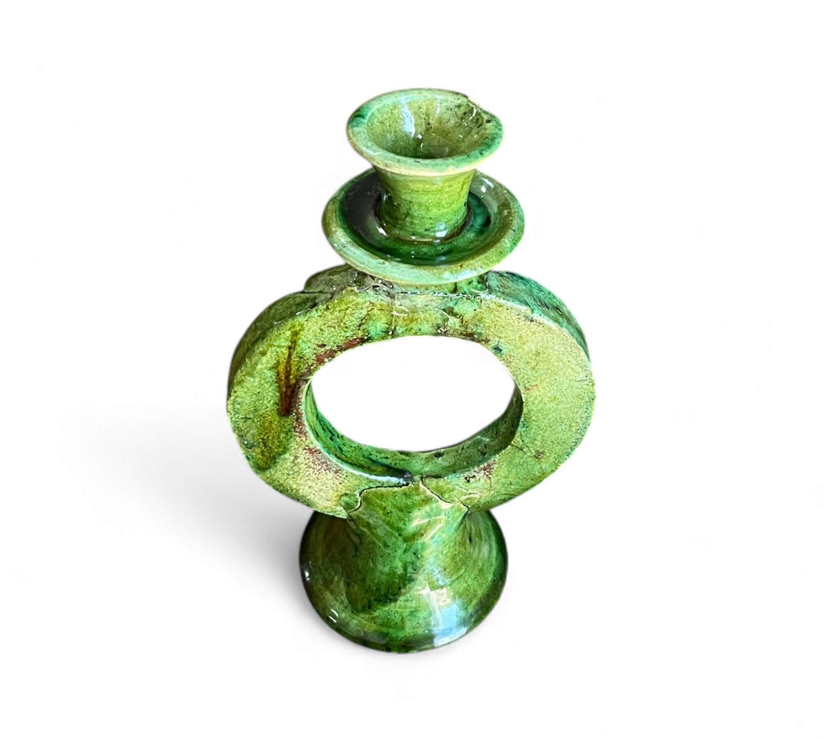 Green ceramic candle holder on a white background