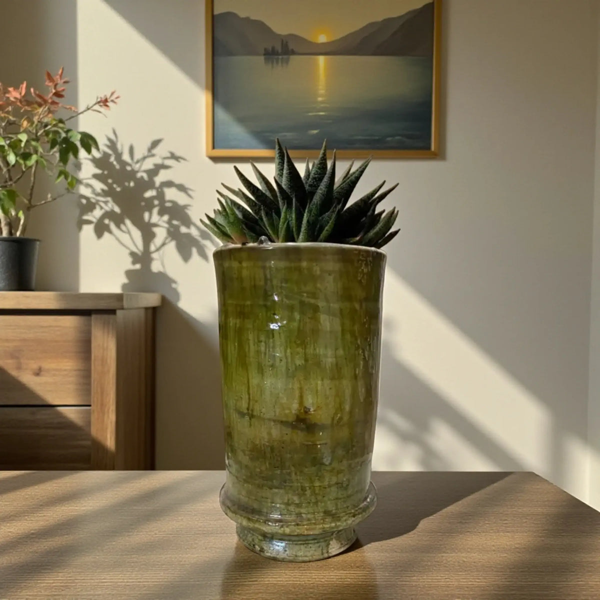 Handmade Tamegroute ceramic vase with green and ochre glaze, cylindrical shape, fired in a traditional Moroccan wood kiln, 22 cm tall
