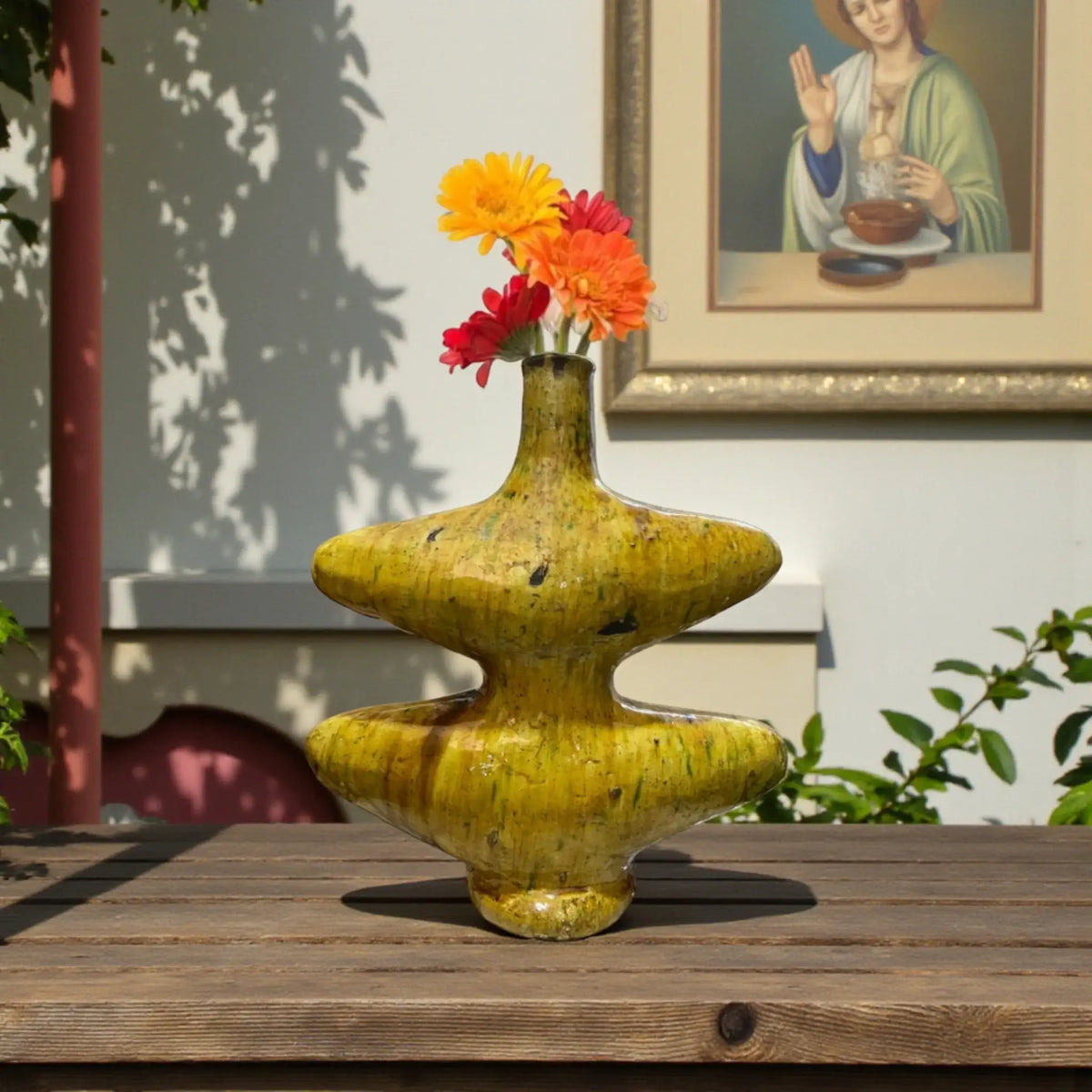 Handmade Tamegroute ceramic vase with sculptural form and natural ochre glaze, crafted in Morocco