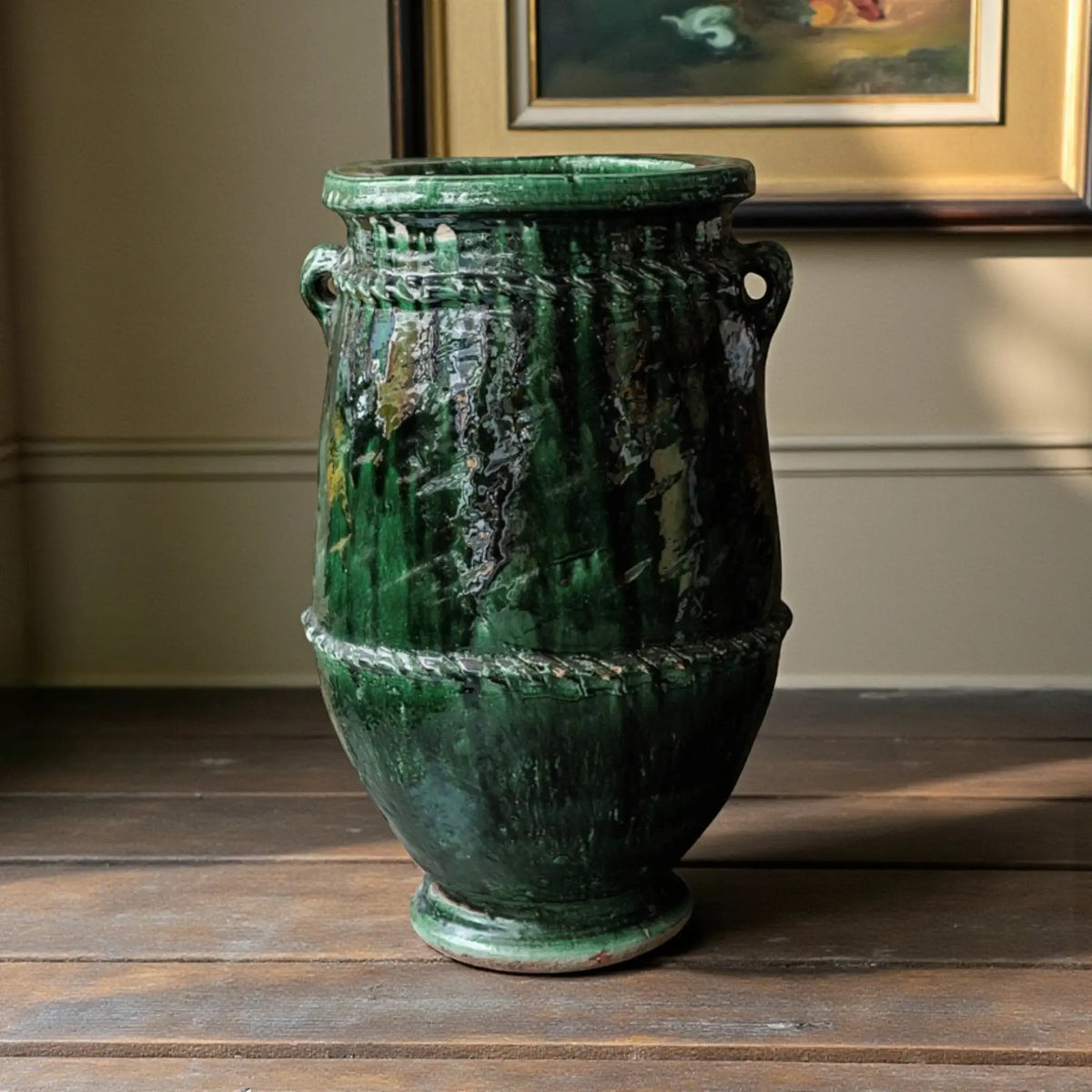 Tall handmade Tamegroute ceramic vase in traditional green glaze displayed as Moroccan floor pottery