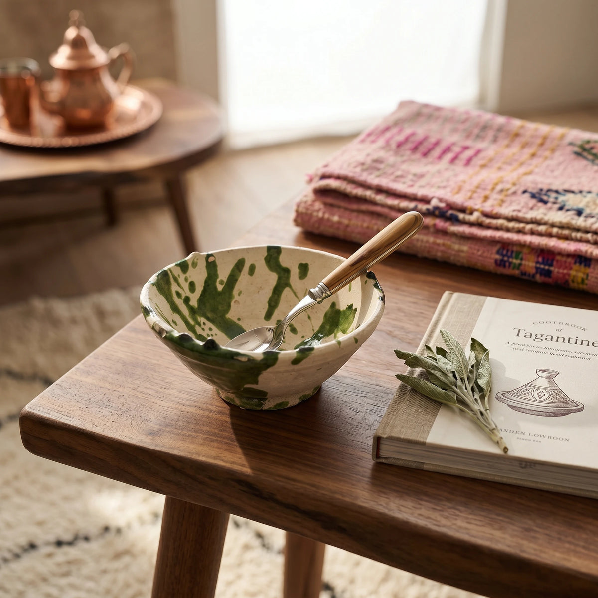 Handmade Moroccan ceramic bowls with green splatter glaze and exposed natural clay finish