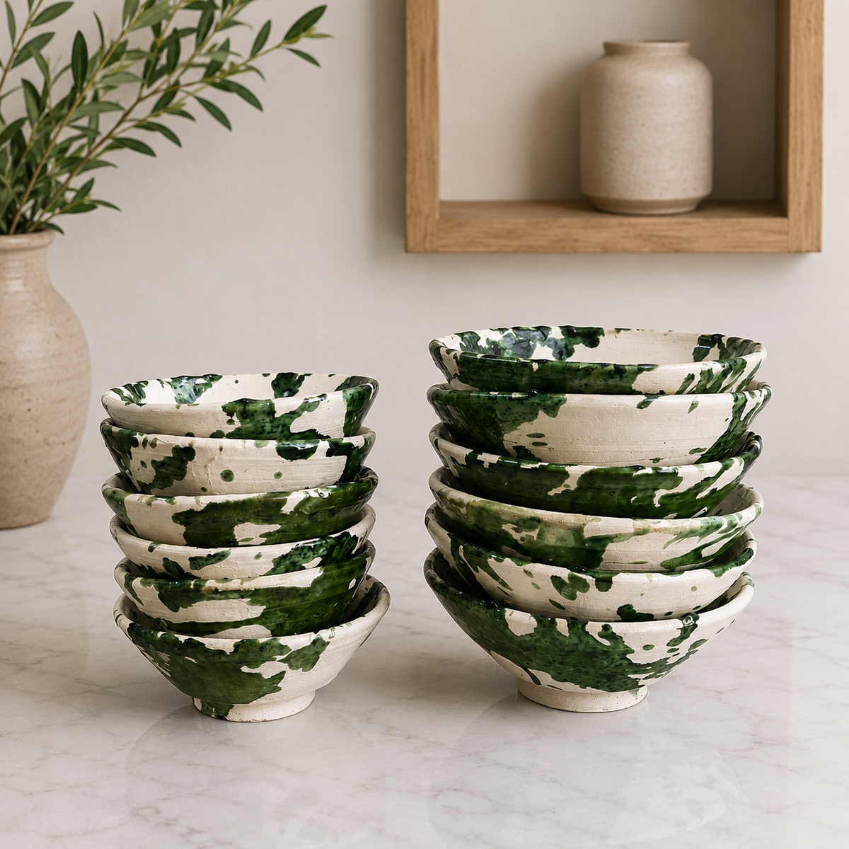 Handmade Moroccan ceramic bowls with green splatter glaze and exposed natural clay finish