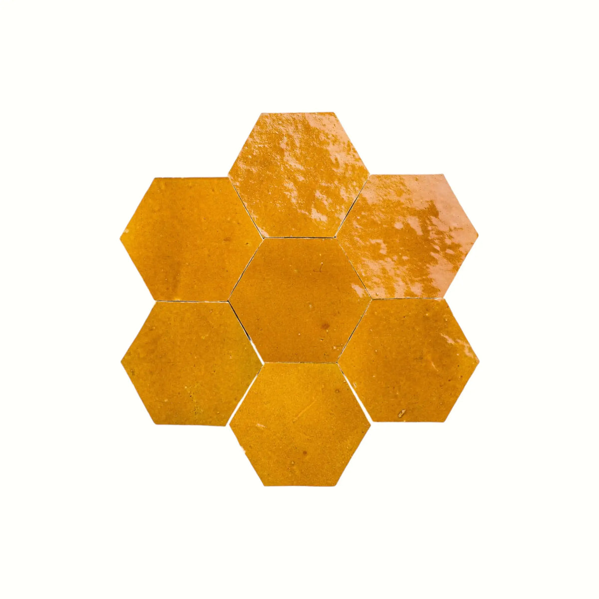 Handmade saffron yellow hexagon Moroccan zellige tiles with natural glaze variation