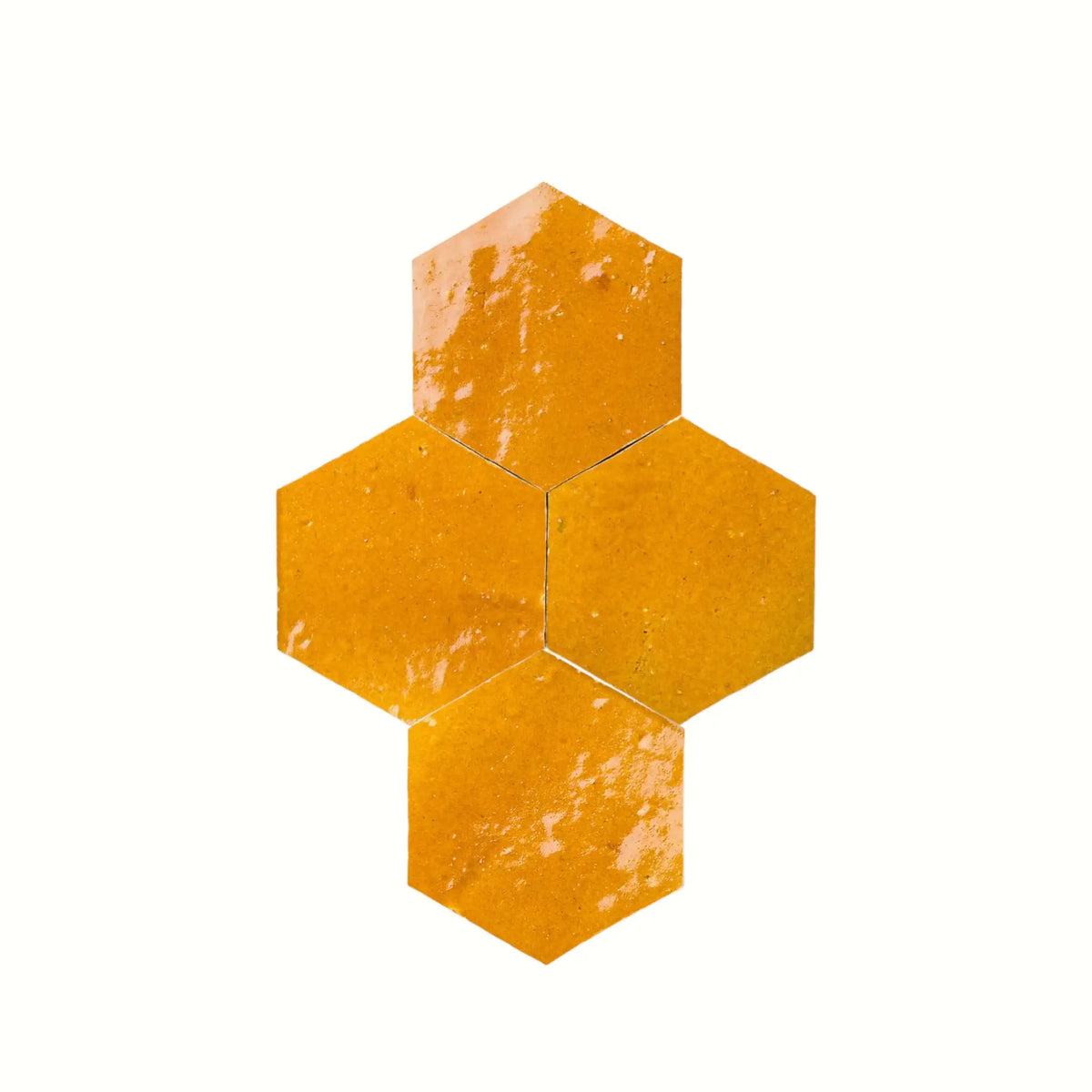 Handmade saffron yellow hexagon Moroccan zellige tiles with natural glaze variation