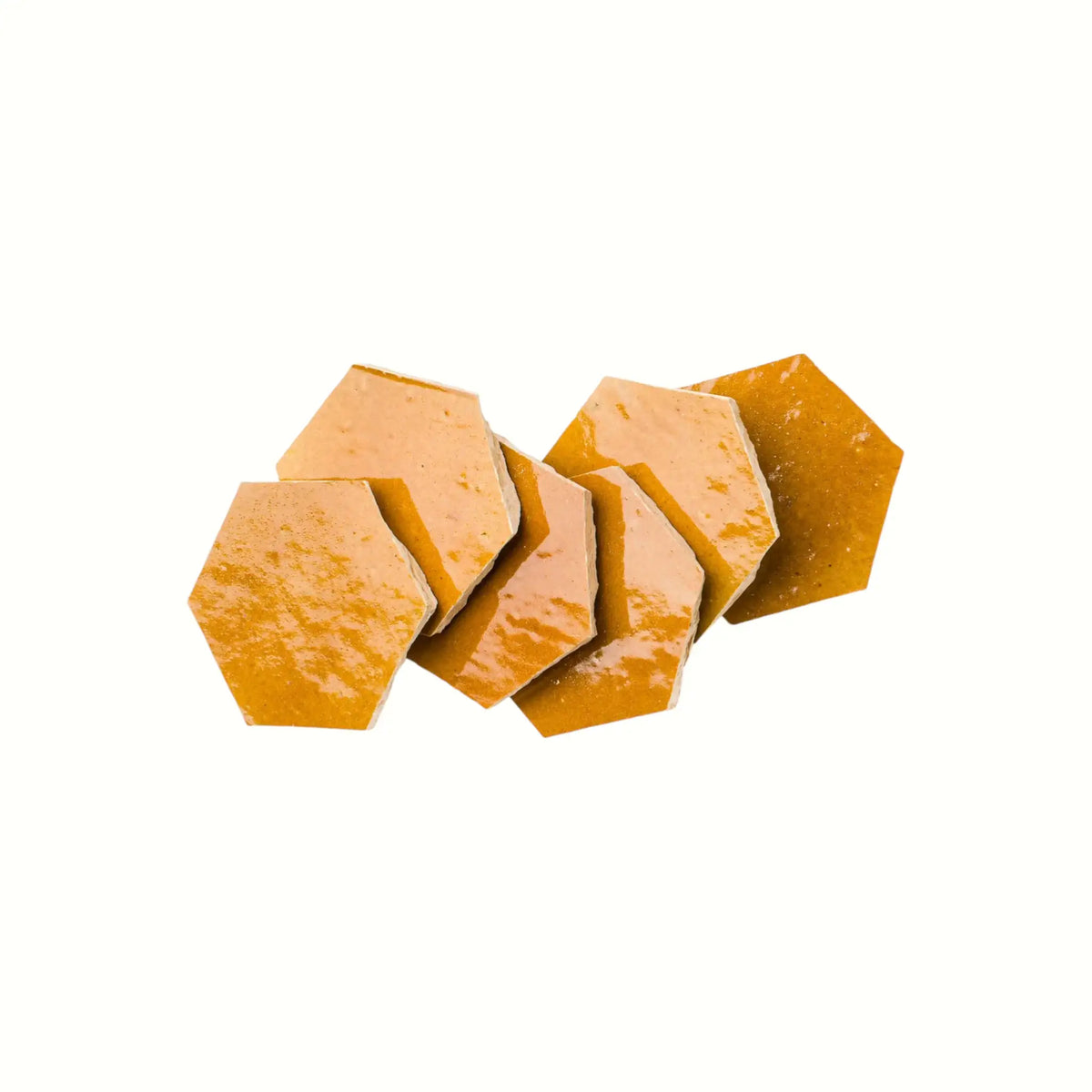 Handmade saffron yellow hexagon Moroccan zellige tiles with natural glaze variation