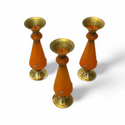 Three Amber resin and brass candlestick with flared top and sunburst medallion, 22 cm tall vintage decorative candle holder on a white background