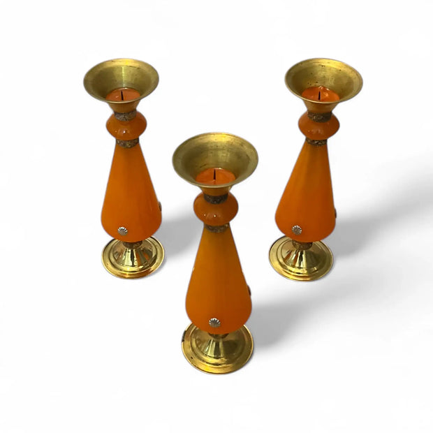 Three Amber resin and brass candlestick with flared top and sunburst medallion, 22 cm tall vintage decorative candle holder on a white background