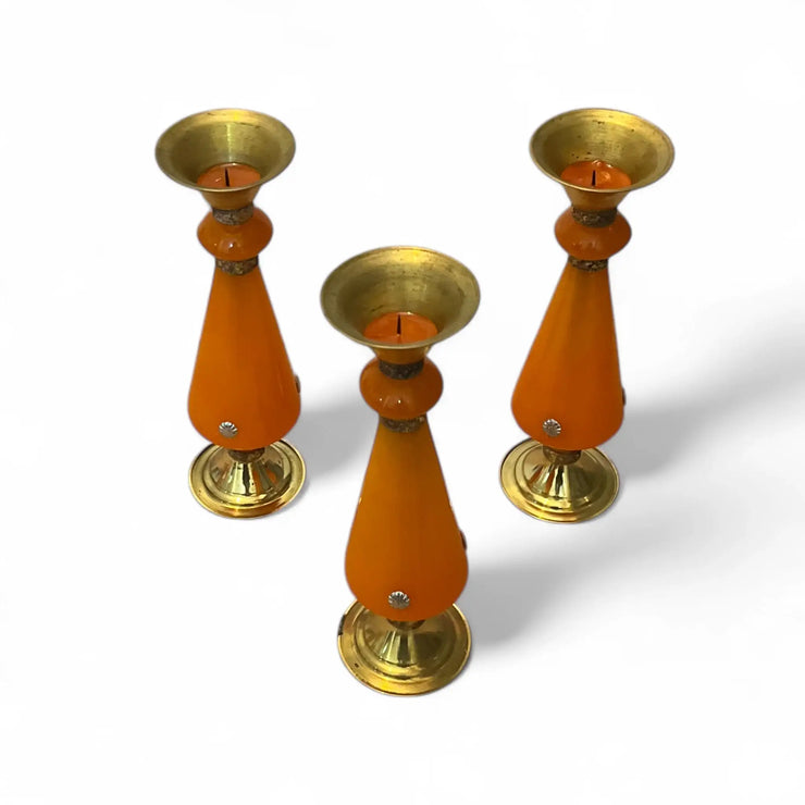 Three Amber resin and brass candlestick with flared top and sunburst medallion, 22 cm tall vintage decorative candle holder on a white background