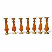 Set of seven Amber resin and brass candlestick with flared top and sunburst medallion, 22 cm tall vintage decorative candle holder  on a white background