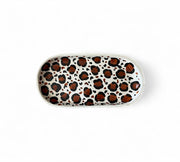 Rectangular tray with leopard print pattern on a white background
