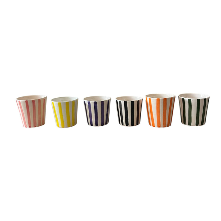 Set of six striped cups in different colors on a white background