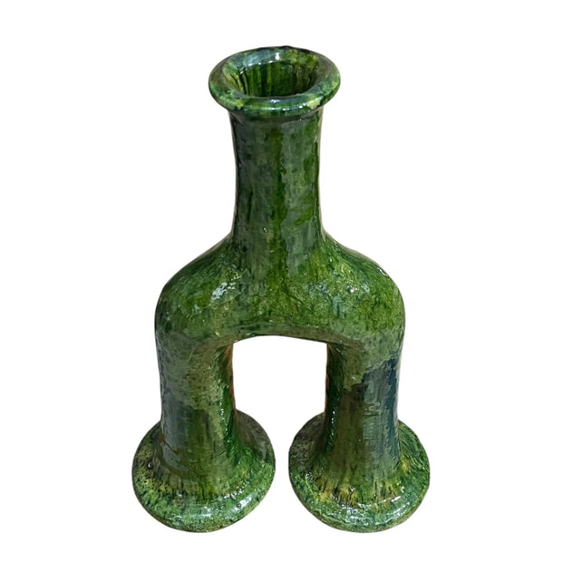 Green ceramic vase with unique design on a white background