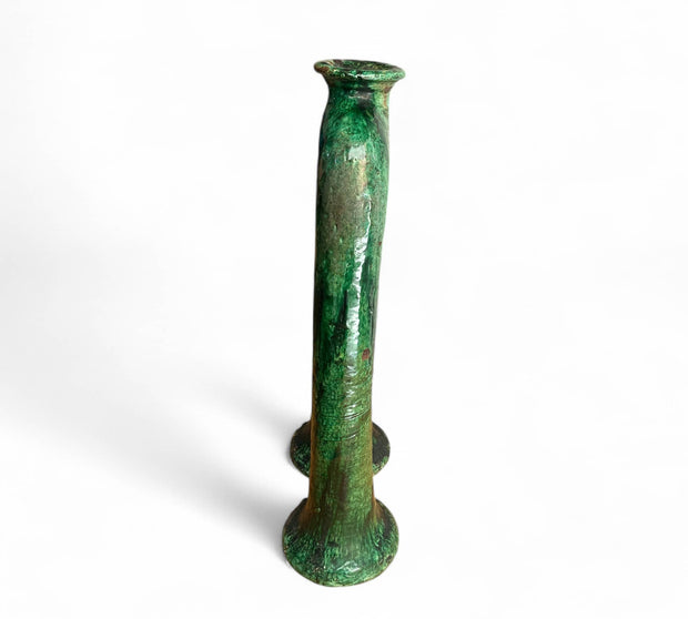 Green glass vase on a white background