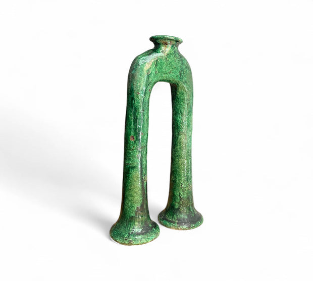 Green ceramic vase on a white background