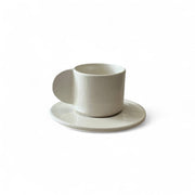 White ceramic cup and saucer on a white background