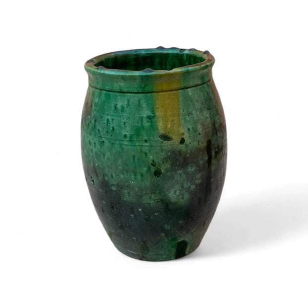 Green ceramic vase on a white background