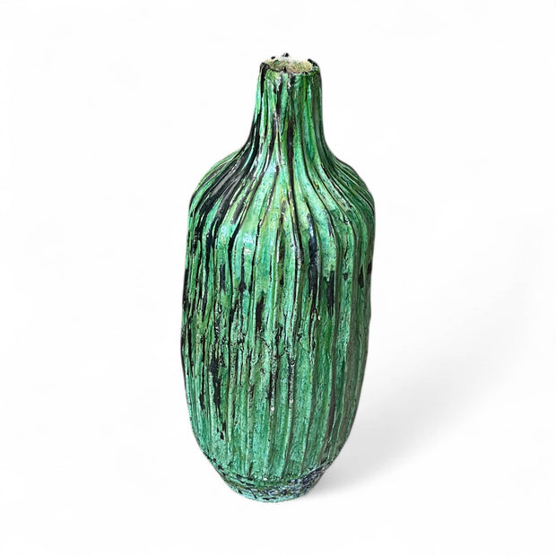 Green textured vase on a white background