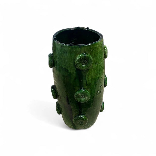 Green ceramic vase with bulbous design on a white background