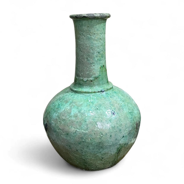 Greenish-brown ceramic vase on a white background