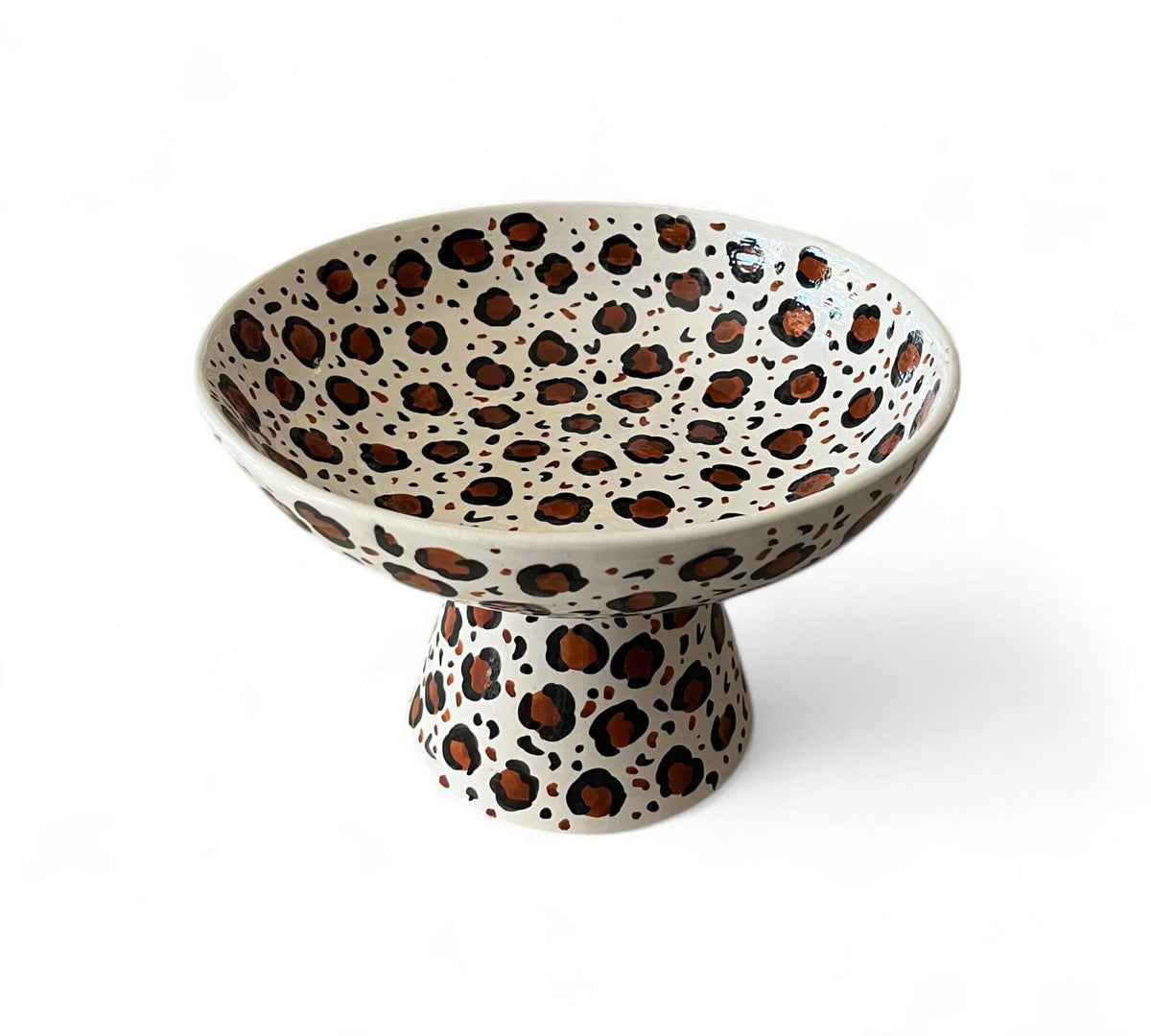 Ceramic bowl with leopard print design on a white background