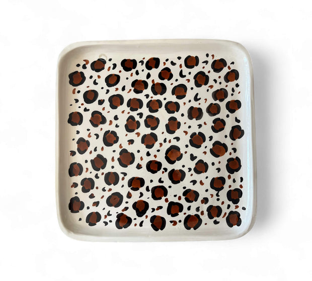 Rectangular tray with leopard print pattern on a white background
