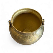 Brass pot with handles on a white background
