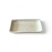 Rectangular ceramic dish with geometric pattern on a white background