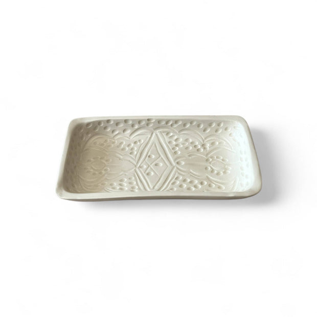 Rectangular ceramic dish with geometric pattern on a white background