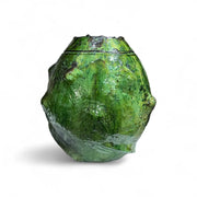 Green ceramic vase on a white background
