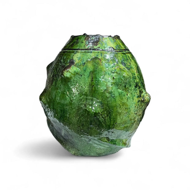 Green ceramic vase on a white background