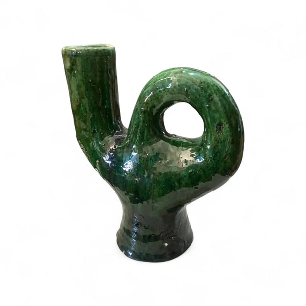 Green ceramic vase with unique shape on a white background