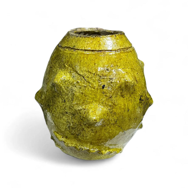 Yellow ceramic vase on a white background