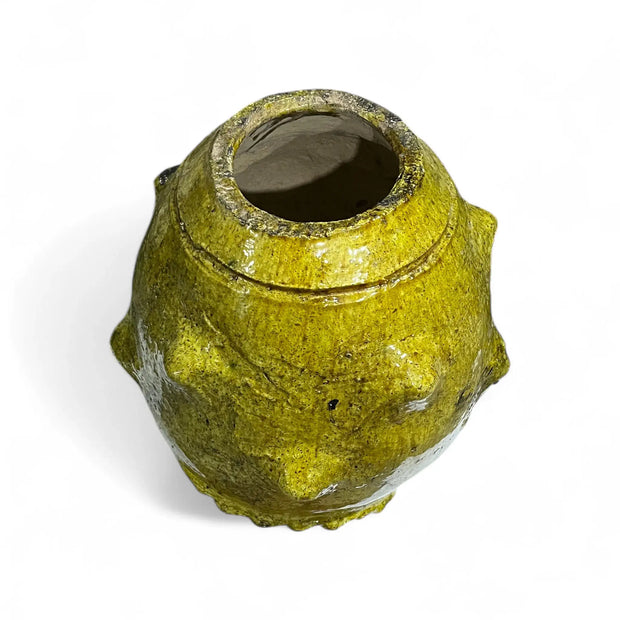 Yellow textured vase on a white background