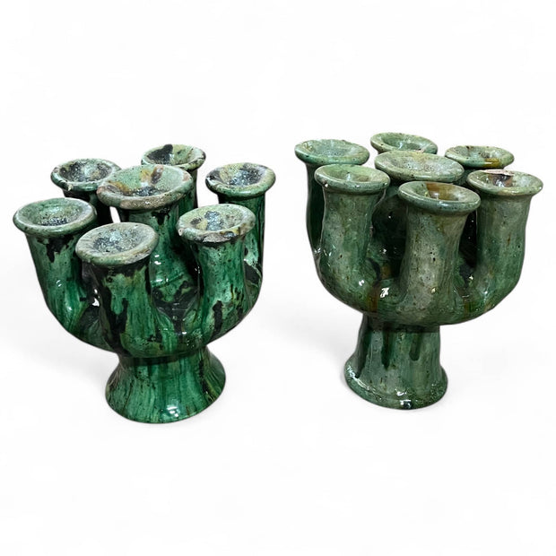 Set of green ceramic cups with a textured surface on a white background