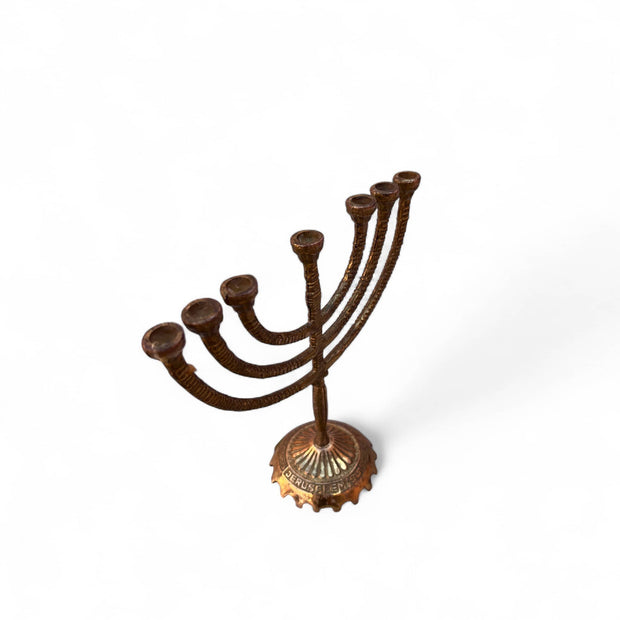 Bronze menorah on a white background