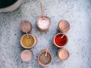  Wooden Spice Jars with accompanying spoons.