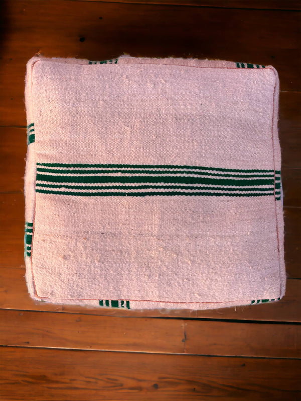 Authentic Moroccan charm in every thread. Unstuffed Berber rug pouf, crafted from 100% wool for warmth and comfort. A historic touch with a Moroccan pattern, ready for your personalization. Smooth zipper for easy customization. Embrace the authenticity delivered to your doorstep.
