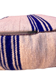 Authentic Moroccan charm in every thread. Unstuffed Berber rug pouf, crafted from 100% wool for warmth and comfort. A historic touch with a Moroccan pattern, ready for your personalization. Smooth zipper for easy customization. Embrace the authenticity delivered to your doorstep.