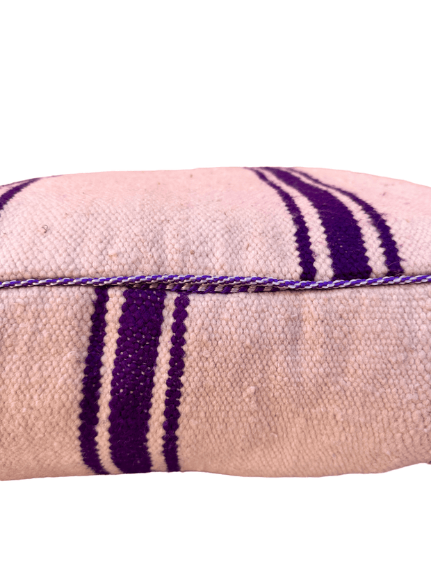 Authentic Moroccan charm in every thread. Unstuffed Berber rug pouf, crafted from 100% wool for warmth and comfort. A historic touch with a Moroccan pattern, ready for your personalization. Smooth zipper for easy customization. Embrace the authenticity delivered to your doorstep.