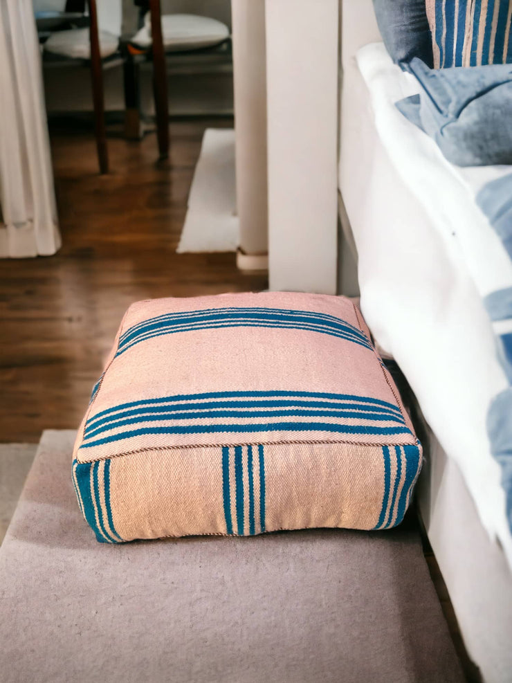 Authentic Moroccan charm in every thread. Unstuffed Berber rug pouf, crafted from 100% wool for warmth and comfort. A historic touch with a Moroccan pattern, ready for your personalization. Smooth zipper for easy customization. Embrace the authenticity delivered to your doorstep.