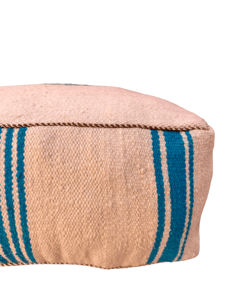 Authentic Moroccan charm in every thread. Unstuffed Berber rug pouf, crafted from 100% wool for warmth and comfort. A historic touch with a Moroccan pattern, ready for your personalization. Smooth zipper for easy customization. Embrace the authenticity delivered to your doorstep.