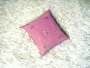 Handmade lumbar cushion with intricate Moroccan Sabra design, perfect for home decor.