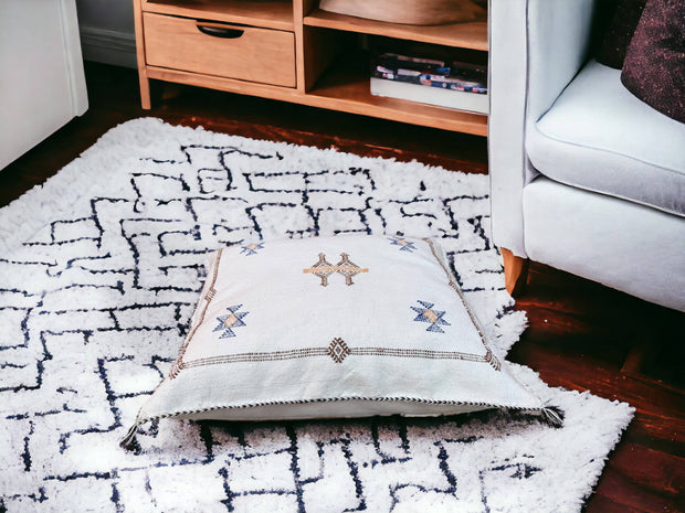 Handmade lumbar cushion with intricate Moroccan Sabra design, perfect for home decor.