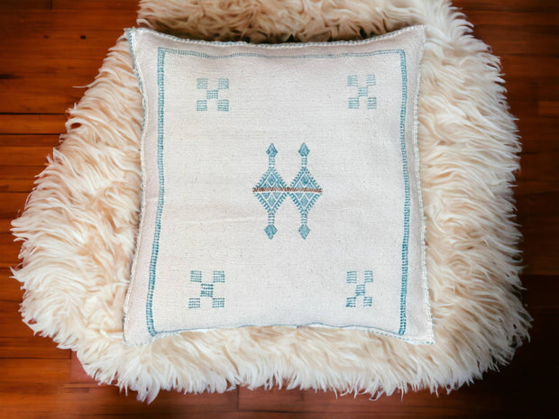 Handmade lumbar cushion with intricate Moroccan Sabra design, perfect for home decor.