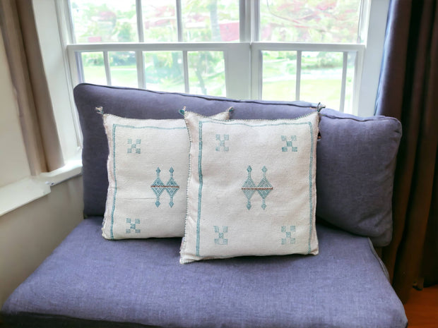 Handmade lumbar cushion with intricate Moroccan Sabra design, perfect for home decor.