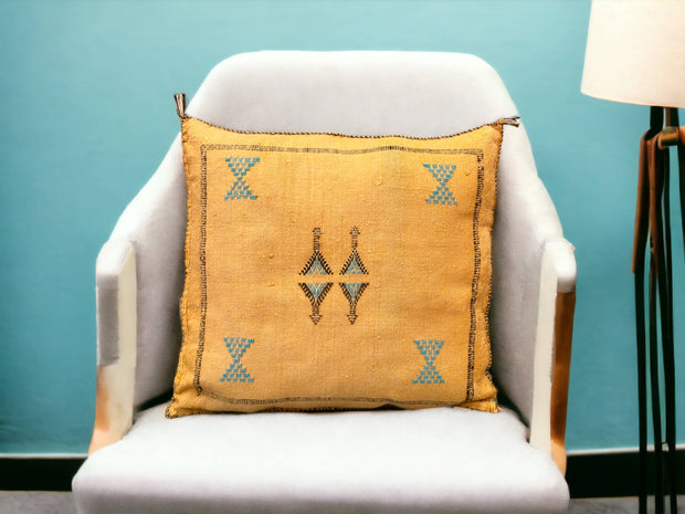 Handmade lumbar cushion with intricate Moroccan Sabra design, perfect for home decor.